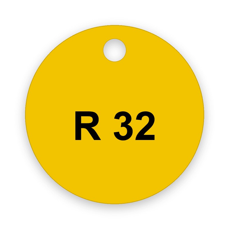 Runde gelbe Ventilmarke mit Loch am oberen Rand, schwarze Gravur R 32 in der Mitte