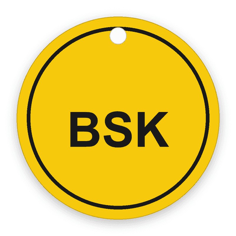 Große runde gelbe Marke mit umlaufendem schwarzem Ring und einer Bohrung oben, schwarze Gravur BSK